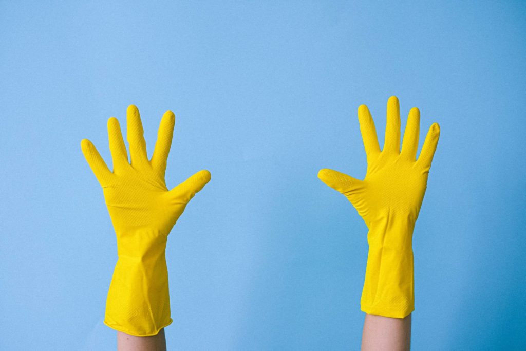 Person wearing rubber gloves
